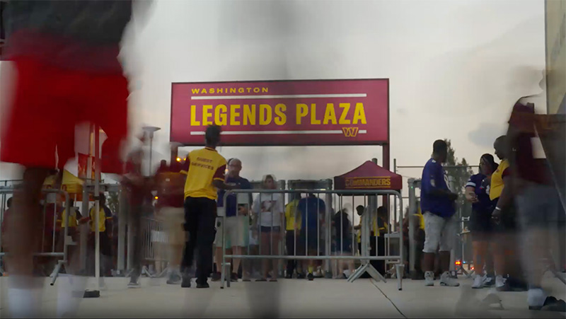 Fans stream into the Washington Commanders stadium.